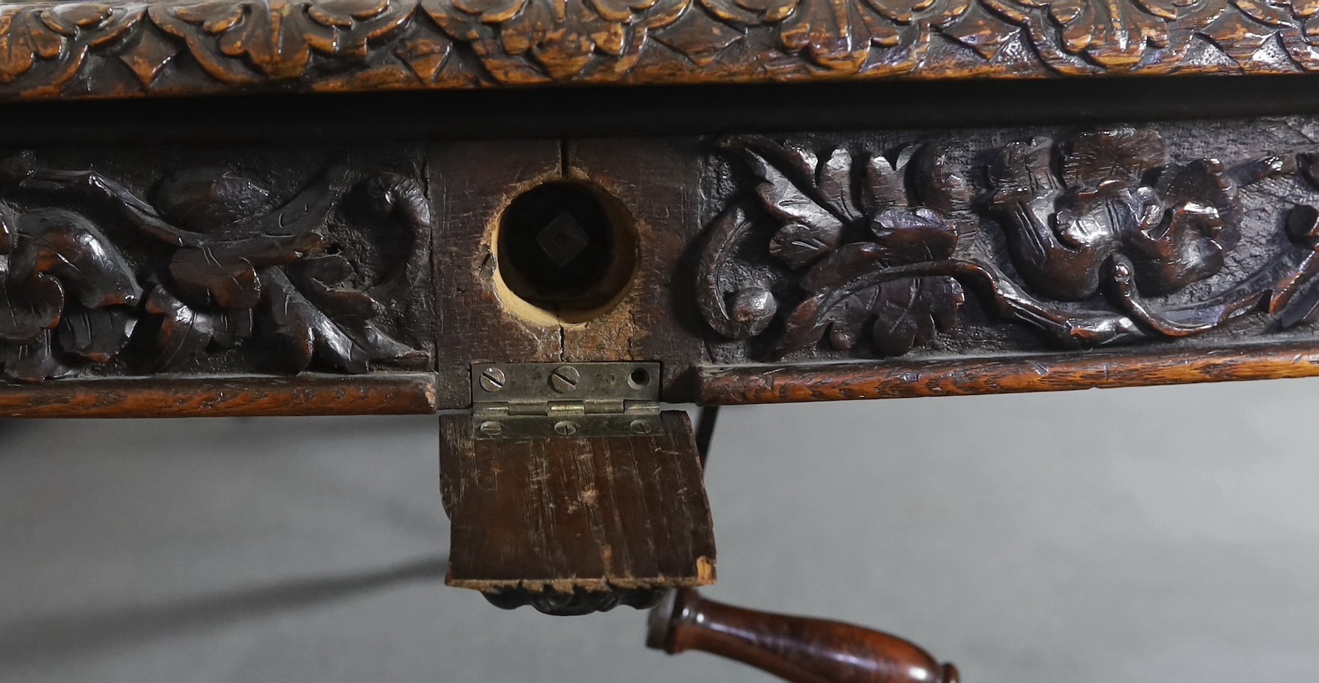 A late Victorian carved oak extending dining table, 178 x 142cm, extends to 356cm H.75cm